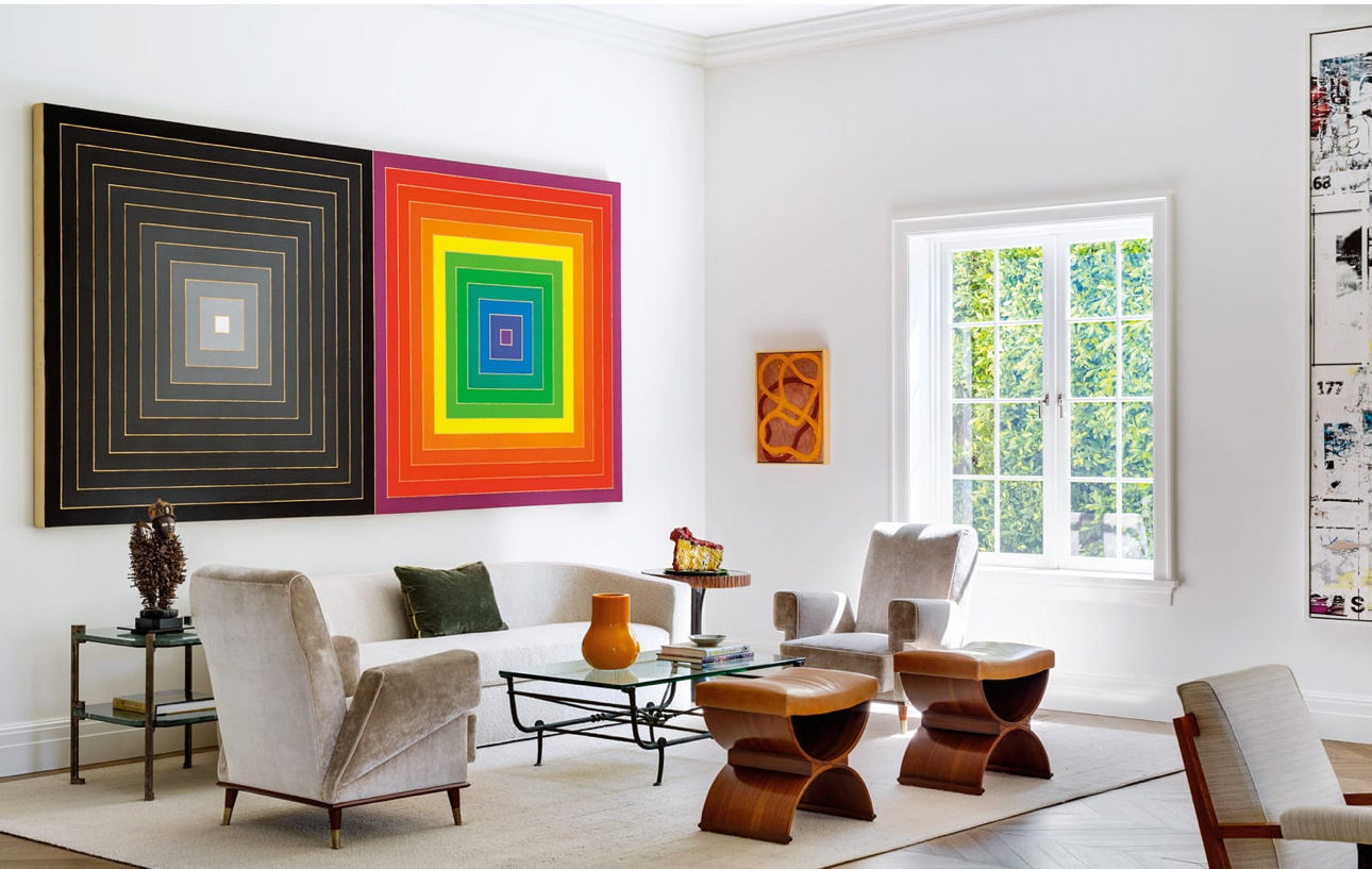 A modern interior featuring framed art in a calm, design-forward space.